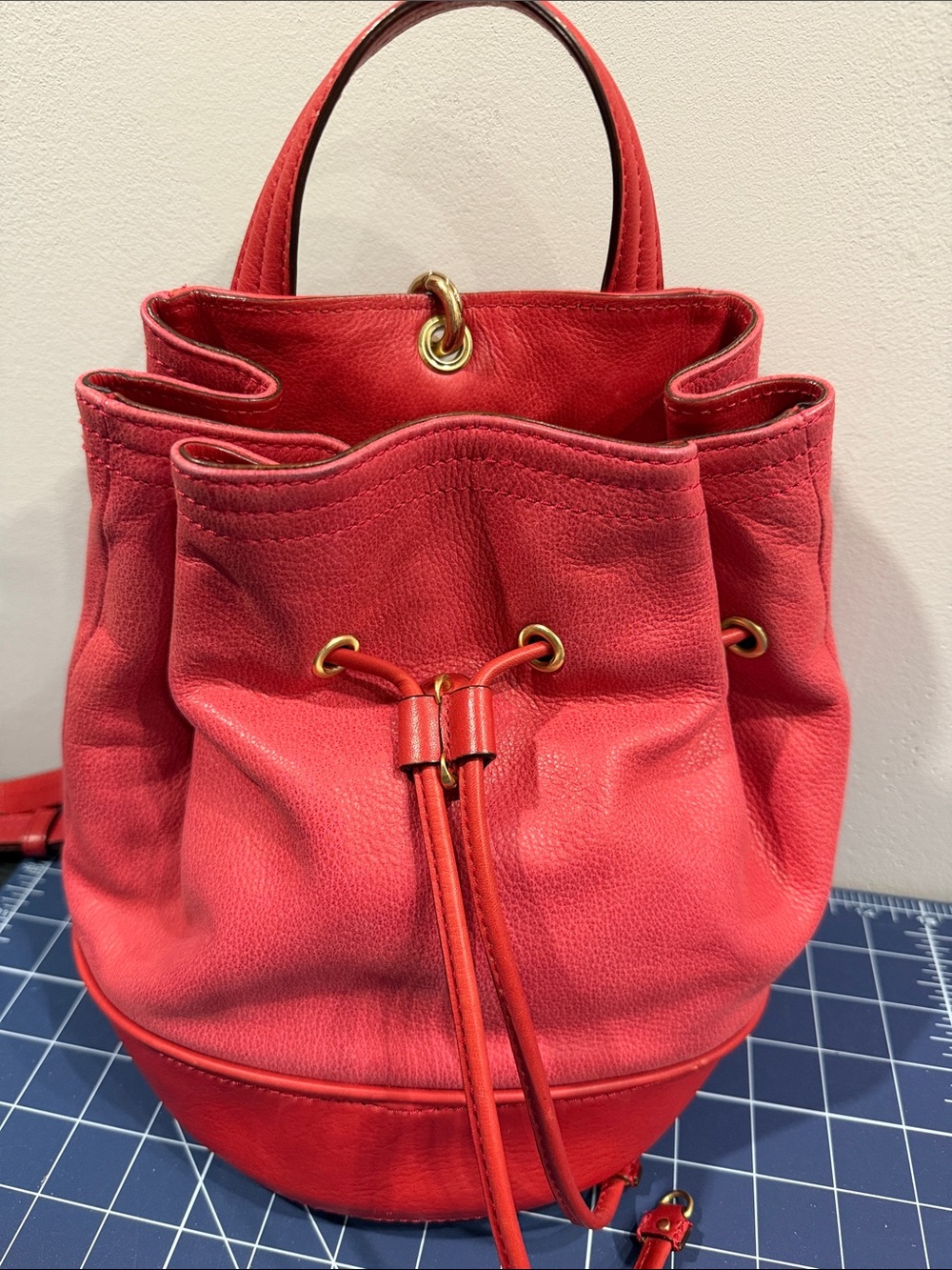 Red Olivia Harris Tribeca Leather Drawstring Bucket Bag or backpack